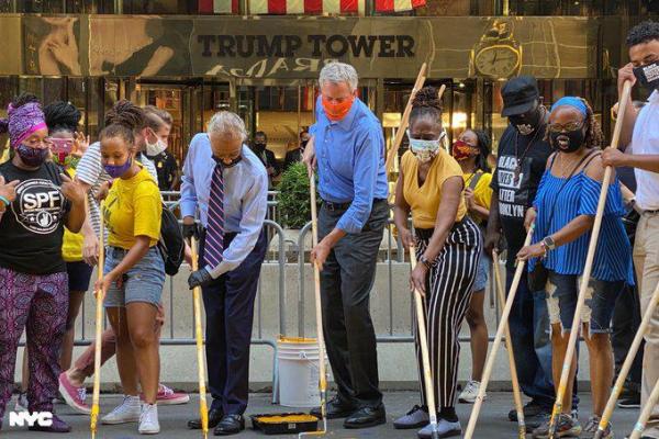 Al Sharpton and Bill de Blasio painting Black Lives Matter in front of Trump Towers