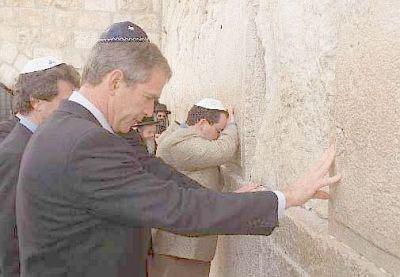 George W. Bush in a yarmulke standing at the Wailing Wall.  His father, George H. W. did the same thing—praying and kissing the wall.
