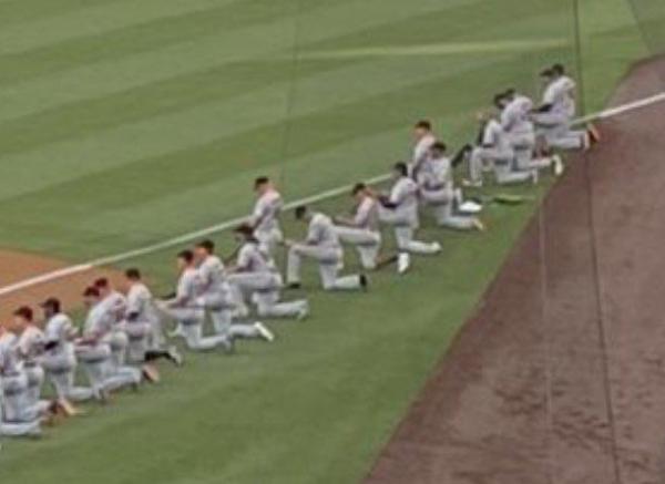 A few San Francisco Giants and Los Angeles Dodgers players and staff kneeling during the national anthem.  Support of Black Lives Matter is support of Marxism.