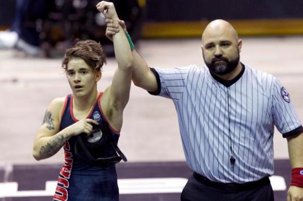 Mack Beggs (left) after defending his Class 6A Girls State Wrestling Title