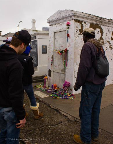 Tourists and locals visit Marie Laveau's tomb to leave gifts and ask for her help in their life matters.