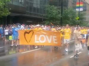 Members of liberal Universalist Unitarian march in the Cincinnati Pride parade.