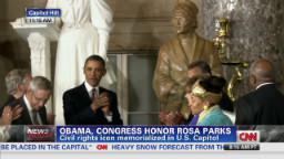 Obama and the Congress honor Rosa Parks.  Her statute is in the back of the picture.