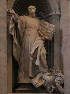 In this statue in the Vatican, Ignatius Loyola can be seen holding the Jesuit Constitution while he tramples underfoot a Christian with a Bible.