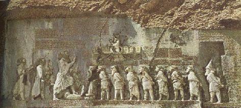 Bas-relief on the Behistun Rock where King Darius is facing nine captives, which are secured by the neck with a rope. A tenth is under the King’s foot.