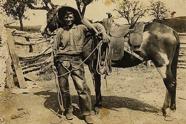 An unknown cowboy, who, judging by his saddle, side arm and rifle was riding the trails circa 1870 or 1880. On the back of this early photograph is simply inscribed “Indian fighter.”