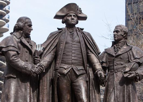 Heald Square Monument in Chicago, Illinois depicting George Washington with Robert Morris and Haym Salomon – the two principal financiers of the American Revolution.