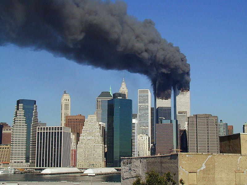 Plumes of smoke billow from the World Trade Center towers. Creative Commons Attribution 4.0 International Public License